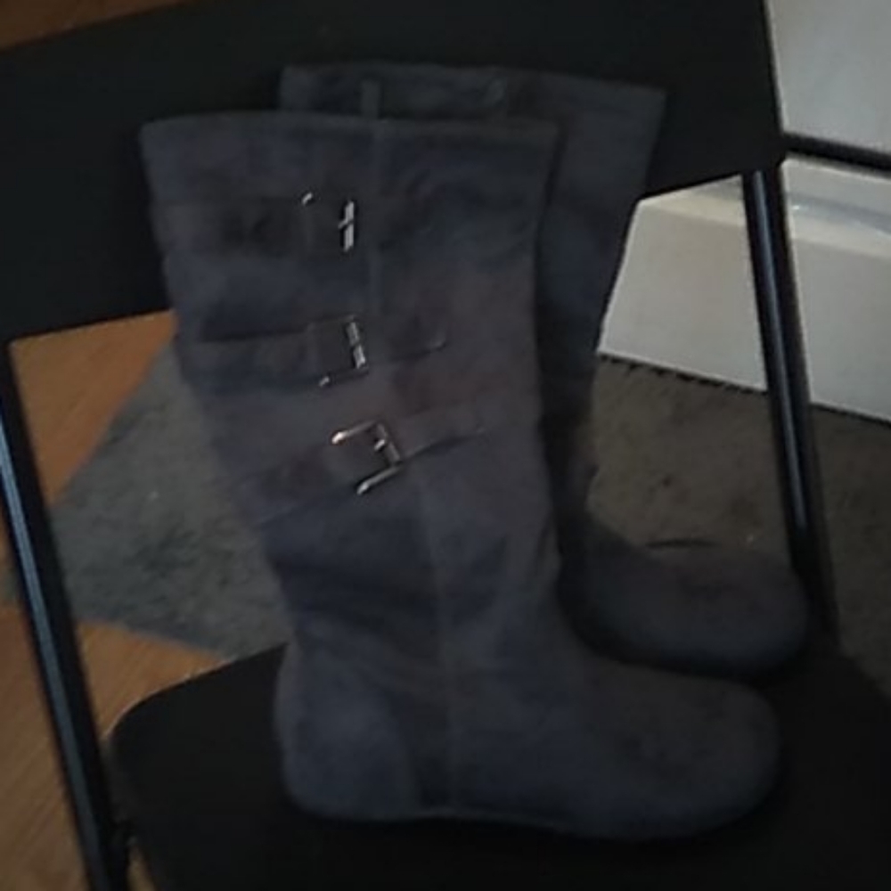 Gray boots with buckles on sides & zippers inside.